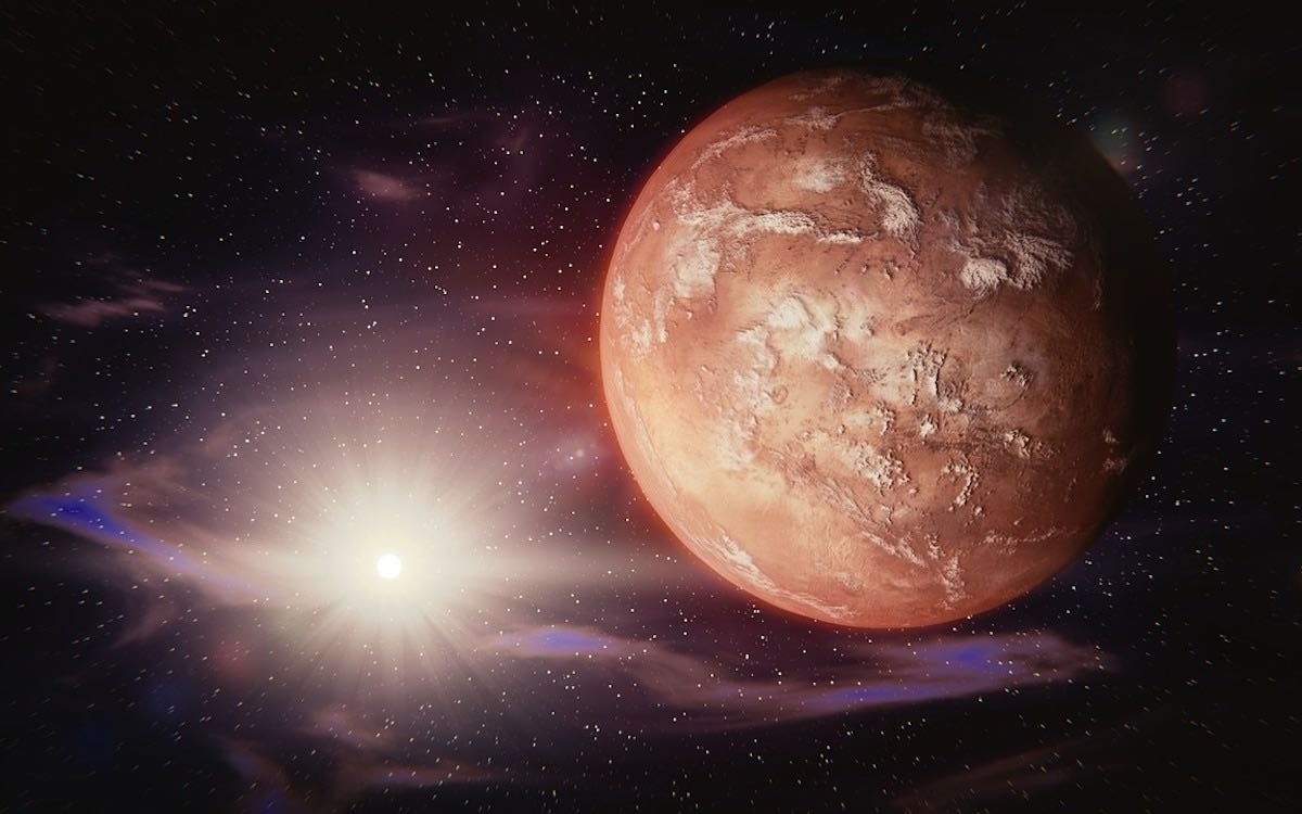 The image shows the Red Planet bathed in the glow of sunlight. China aims to win the new space race with missions to Mars.