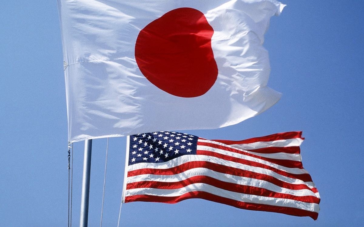 The photo shows the Japanese and American flags. Washington has gone on a concerted campaign to rebuild alliances after the Trump era.